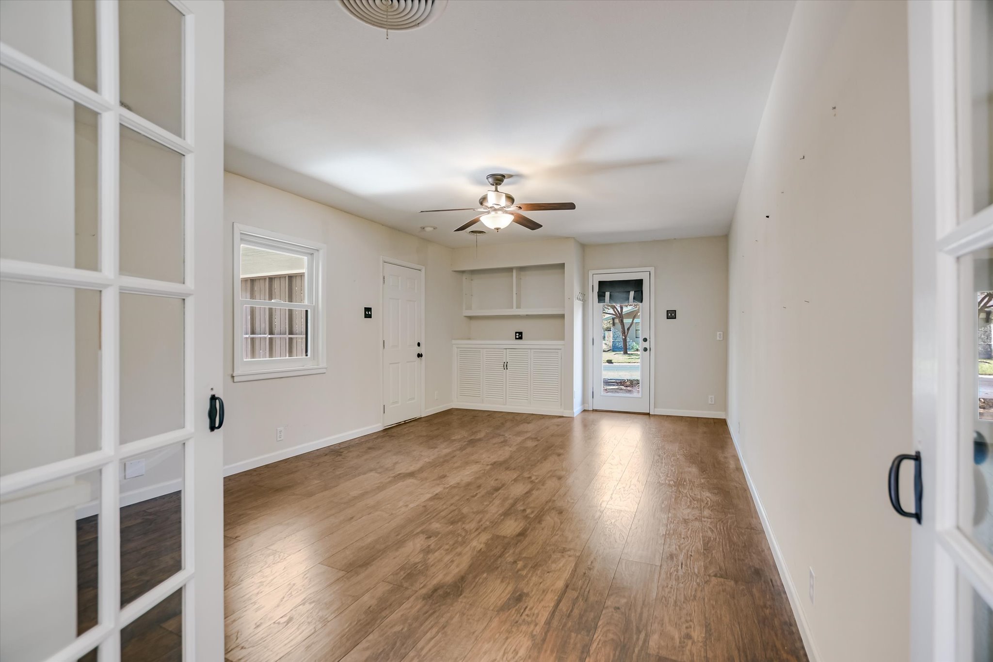 1601 East 19th Street Georgetown, TX 78626 - Photo 10 of 31 wooden floor in an empty room with a window