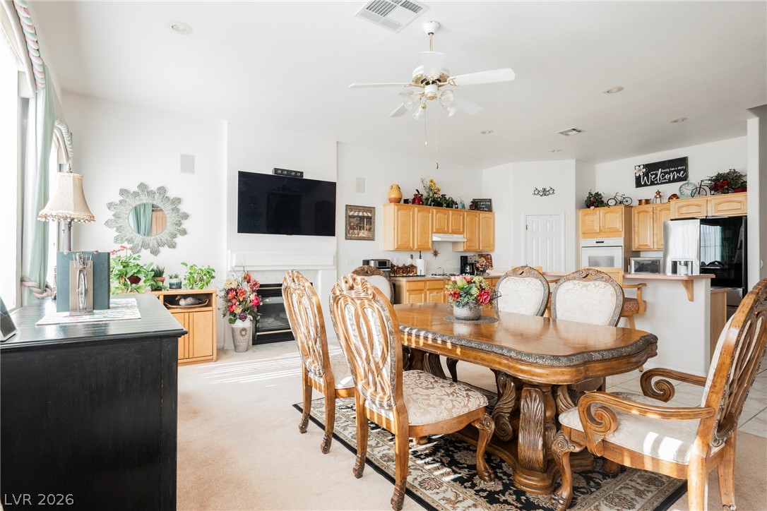 5494 Pine Ranch Street Las Vegas, NV 89113 - Photo 24 of 54 An inviting dining room flows into a well-appointed kitchen, ideal for entertaining and daily living.