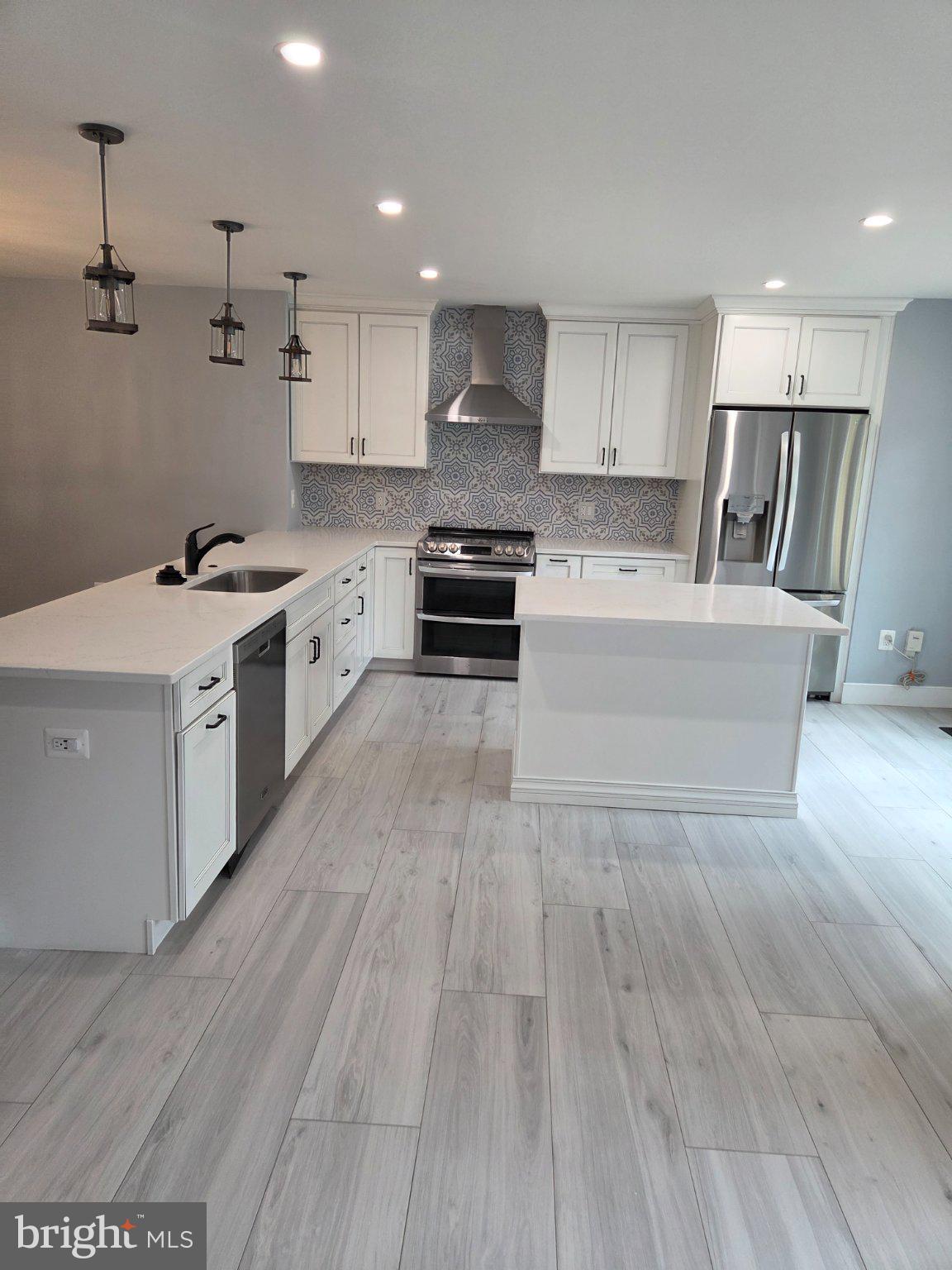 7229 Olde Lantern Way Springfield, VA 22152 - Photo 25 of 32 Modern kitchen with sleek finishes.