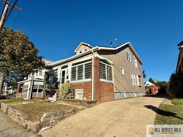 74 Andrew Street Hamilton, NJ 08610 - Photo 3 of 13 a front view of a house with a yard