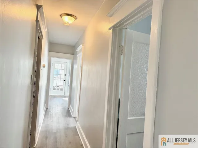 a view of a bathroom from a hallway