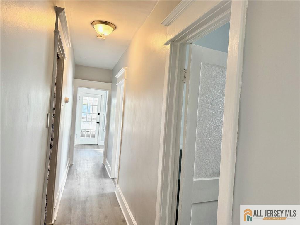 74 Andrew Street Hamilton, NJ 08610 - Photo 6 of 13 a view of a bathroom from a hallway
