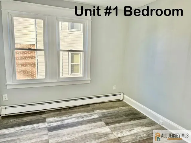 a view of a room with window and a ceiling fan