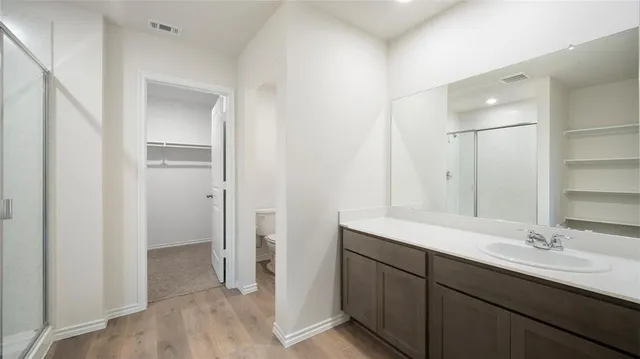 a view of an empty walk in closet