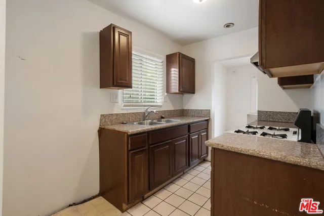 a kitchen with a stove and a sink