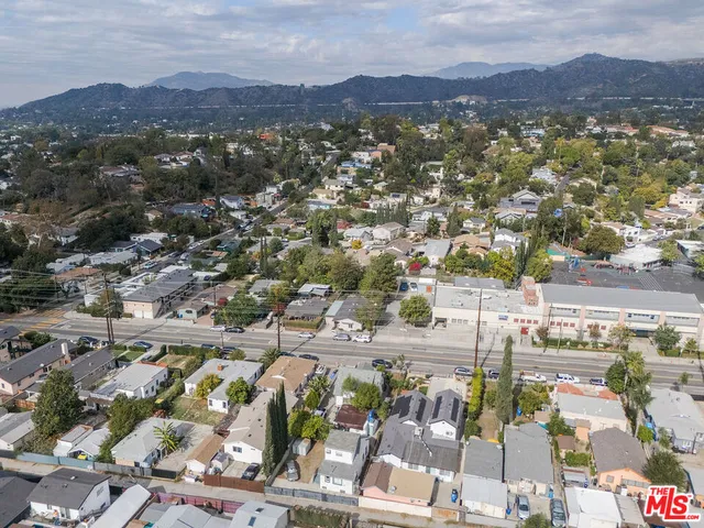 an aerial view of residential houses and outdoor space
