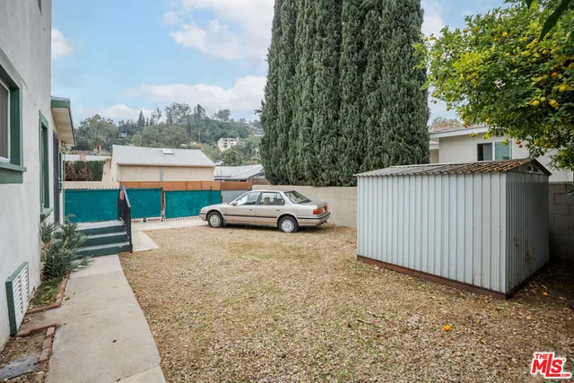 a view of a car parked in front of a house