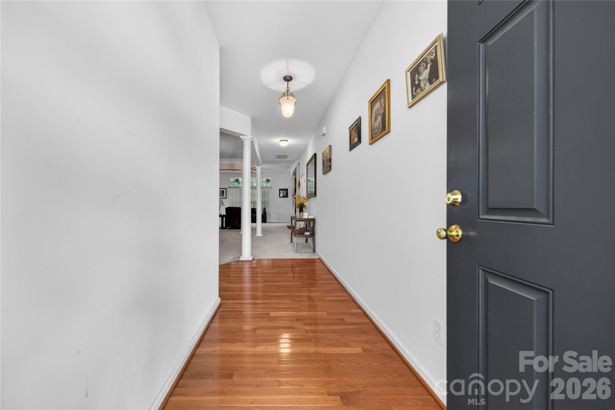 533 Fair Oaks Drive Fort Mill, SC 29708 - Photo 2 of 33 a view of a hallway with wooden floor and staircase