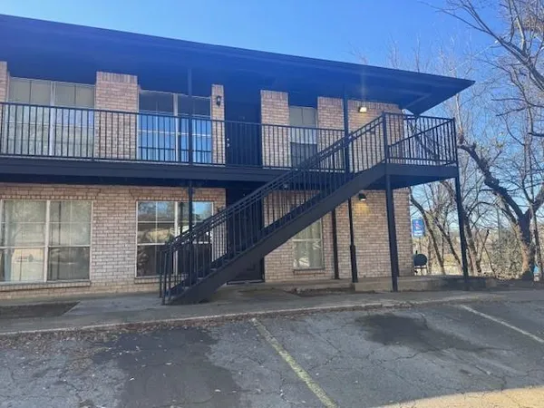 a view of a house with a street