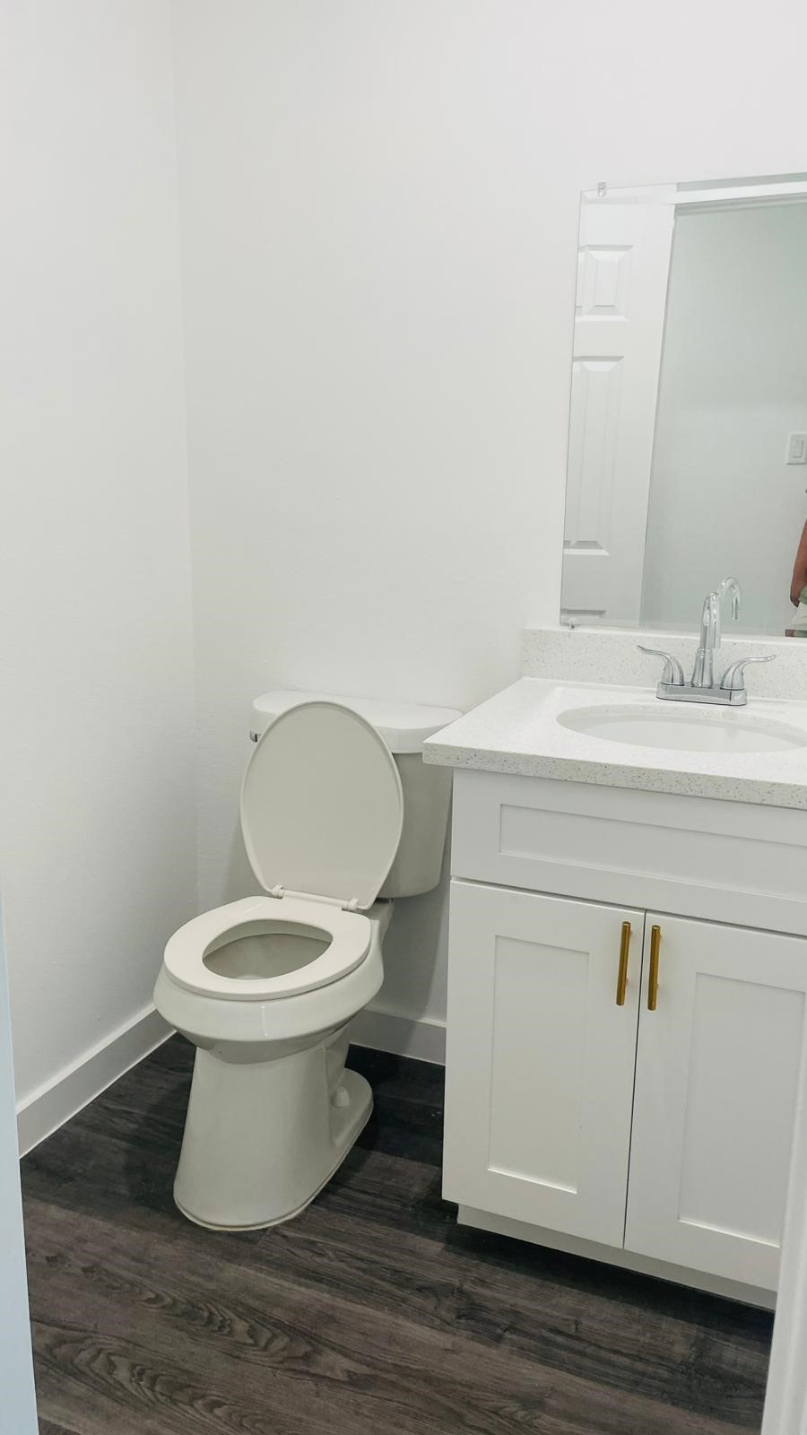 8414 Sandra Street, Unit A Houston, TX 77016 - Photo 11 of 14 a white toilet sitting next to a bathroom sink