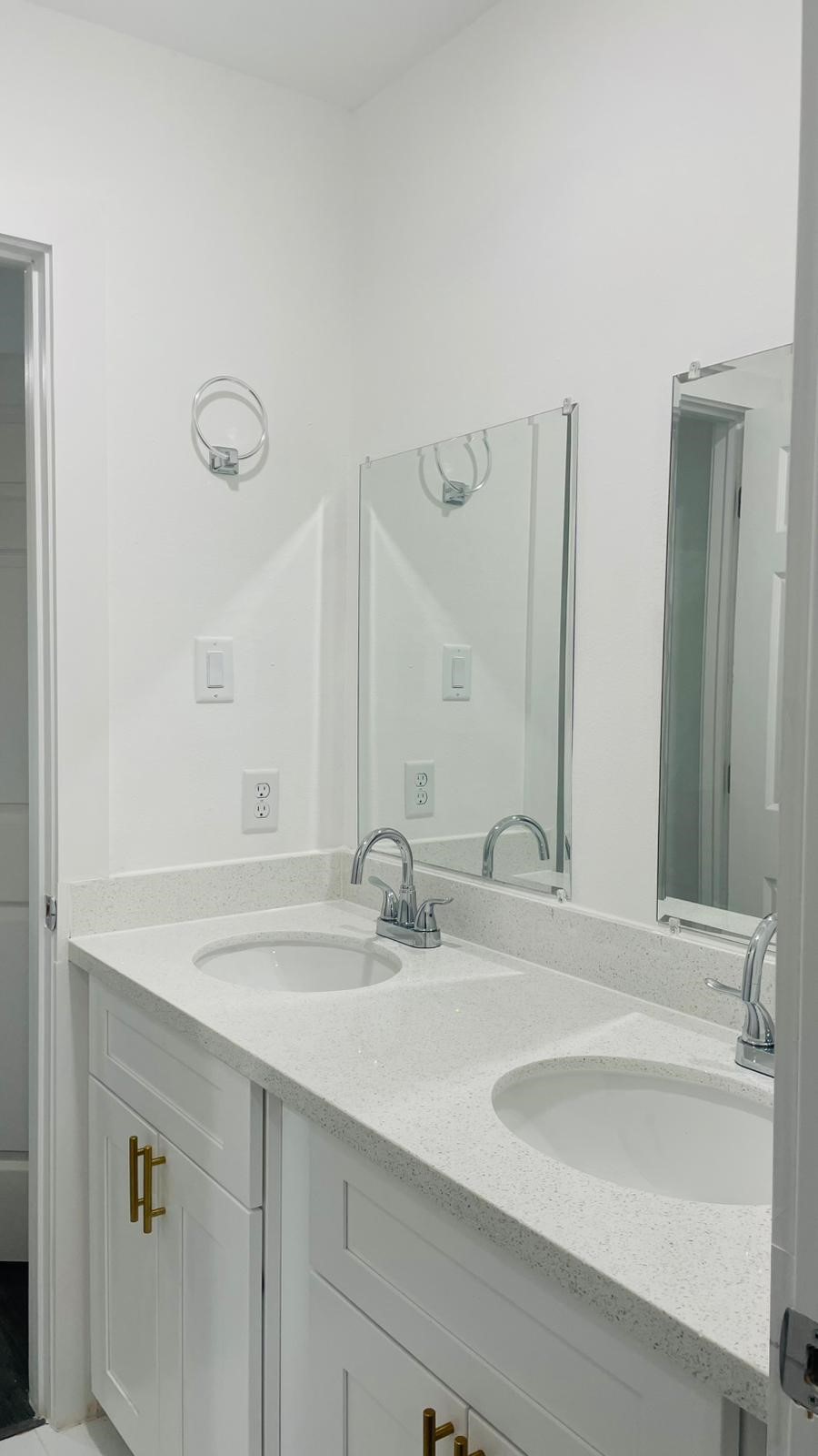 8414 Sandra Street, Unit A Houston, TX 77016 - Photo 8 of 14 a bathroom with double vanity sinks and a mirror