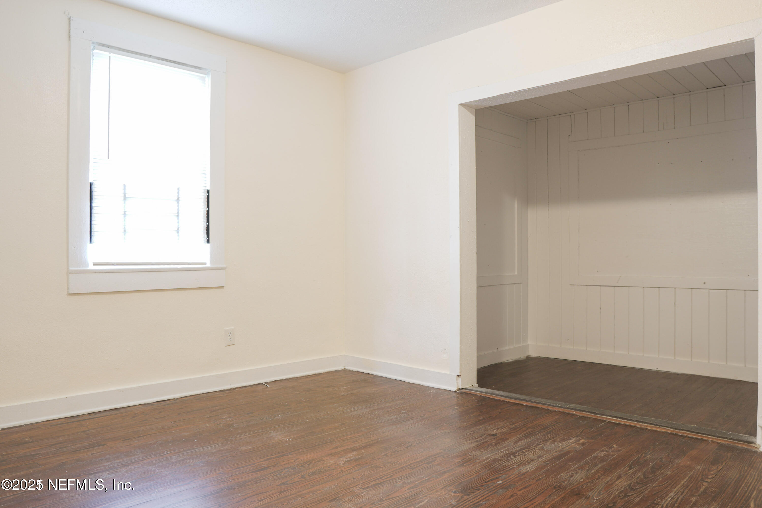 1473 State Street West Jacksonville, FL 32209 - Photo 12 of 12 an empty room with wooden floor and windows