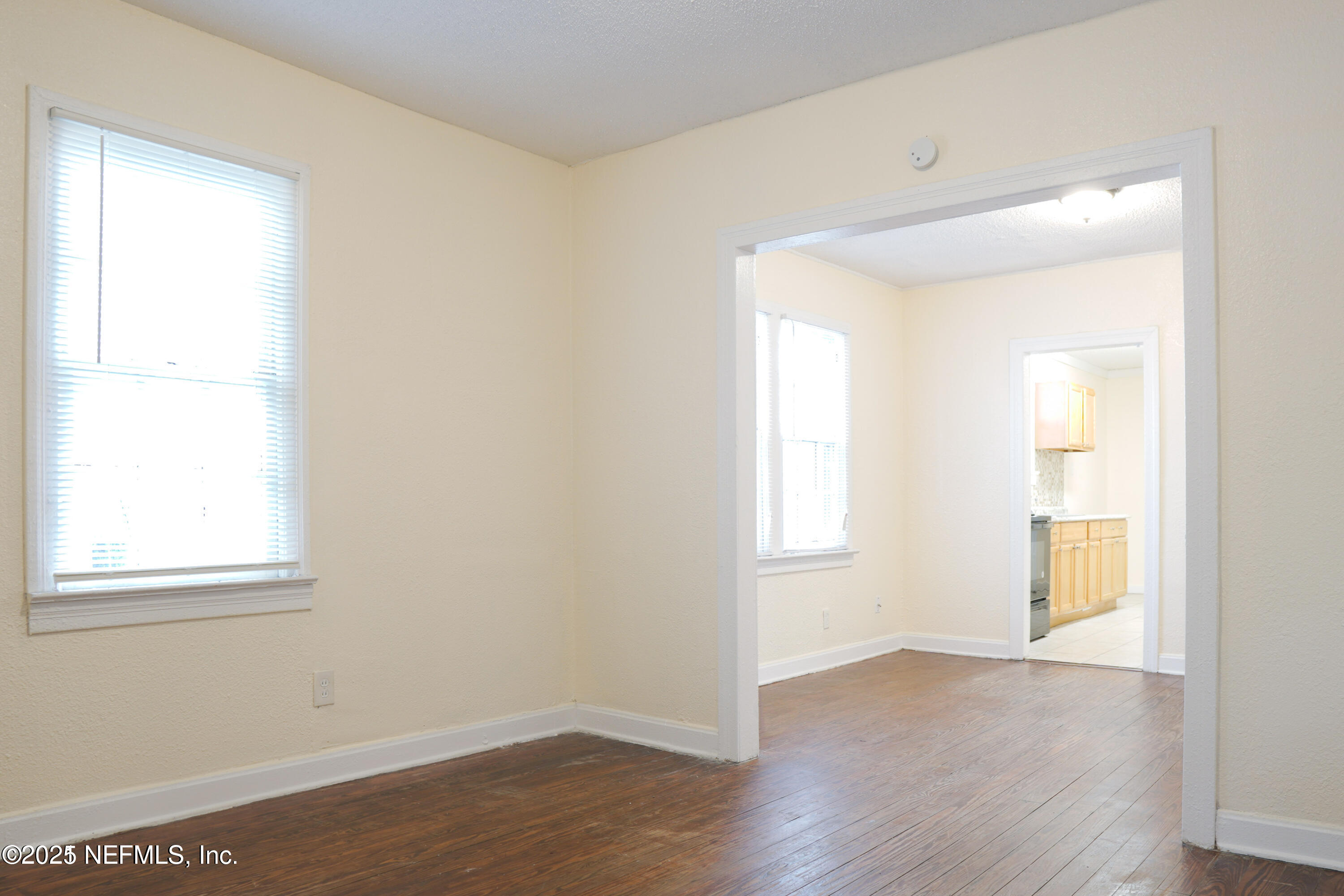 1473 State Street West Jacksonville, FL 32209 - Photo 6 of 12 an empty room with wooden floor and windows