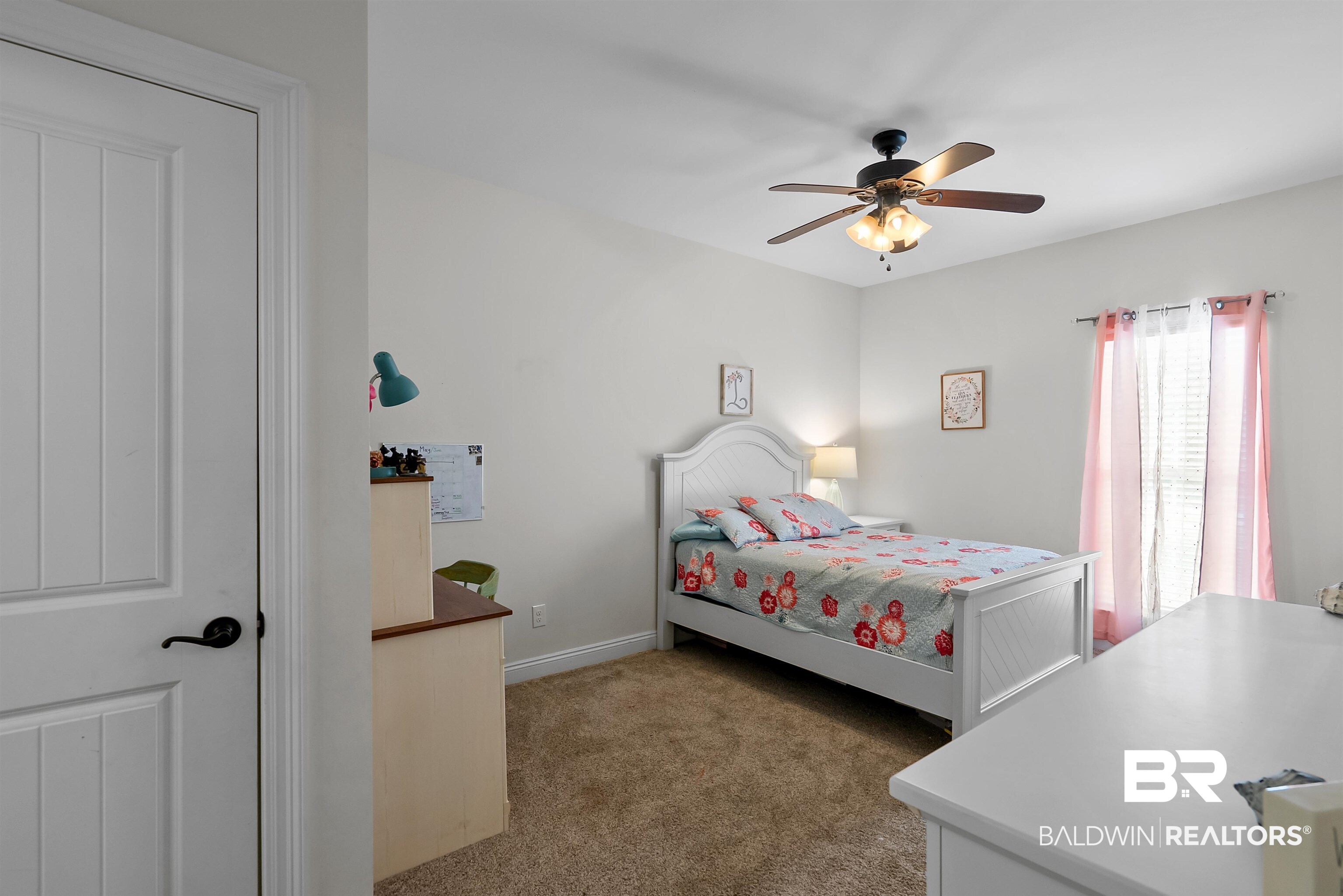 12070 Comalander Road Fairhope, AL 36532 - Photo 29 of 50 Bright bedroom featuring a ceiling fan with integrated lighting, carpeted flooring, and a large window with vertical blinds
