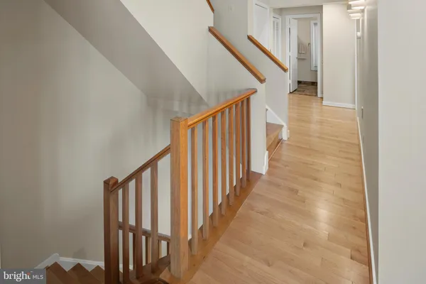 a bedroom with a bed and a large window with balcony view