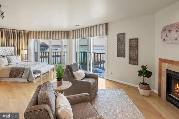 a bath tub sitting next to a blue sink and a mirror