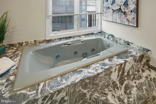 a view of empty room with a fireplace