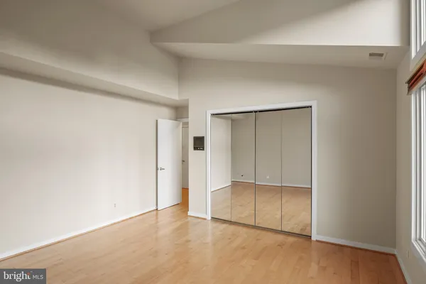 a view of roof deck with two chairs and wooden fence