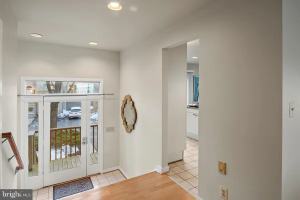 a kitchen with a stove a refrigerator and a dining table