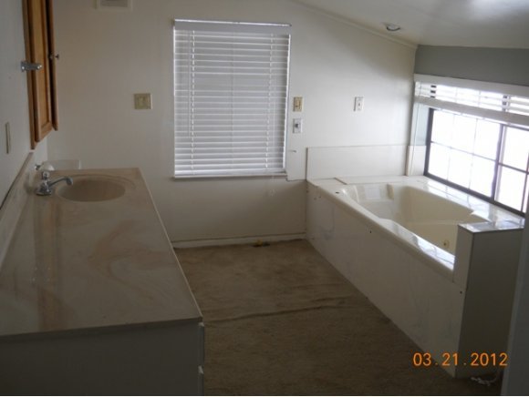 8255 South Breezy Pine Road Mayer, AZ 86333 - Photo 7 of 12 a bathroom with a tub sink and window