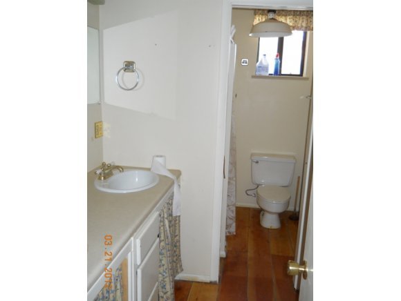 8255 South Breezy Pine Road Mayer, AZ 86333 - Photo 8 of 12 a bathroom with a sink and toilet