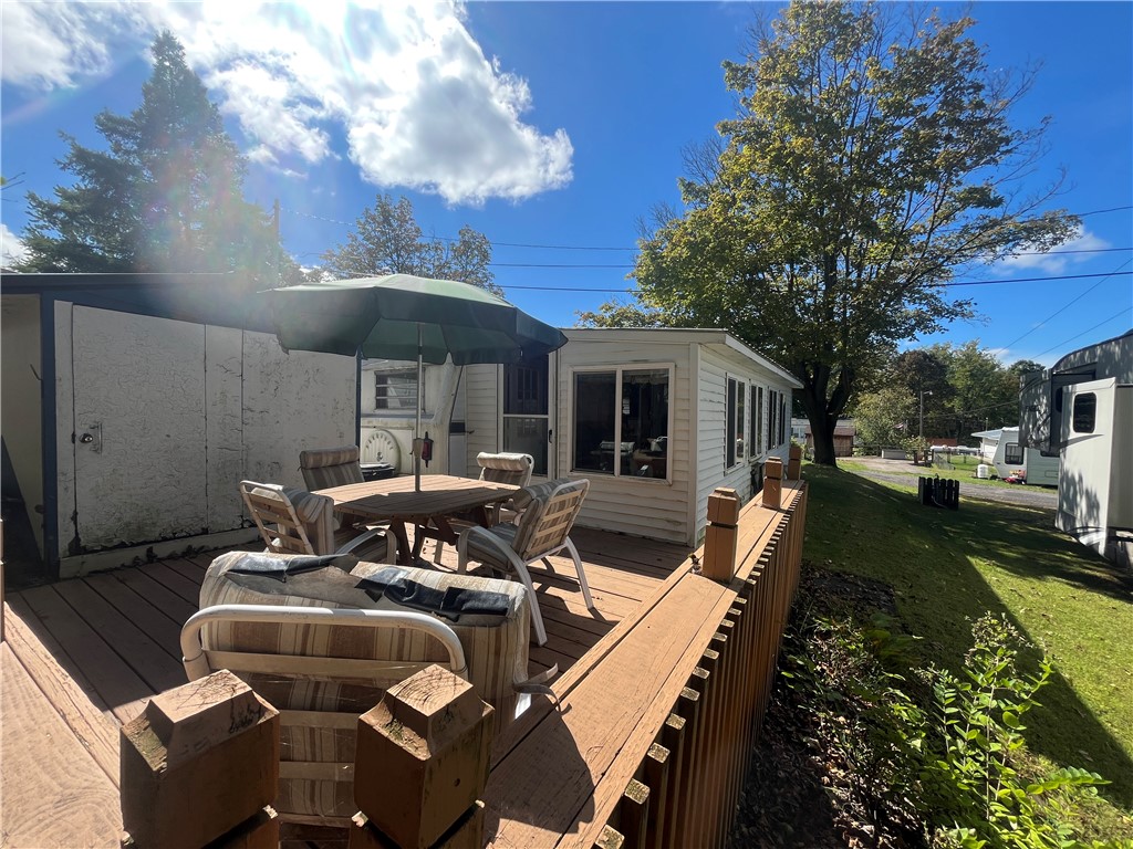 7945 Lake Road, Unit 34 Sodus, NY 14555 - Photo 8 of 24 ENJOY THE ATTACHED DECK AREA- WALK RIGHT TO THE PO