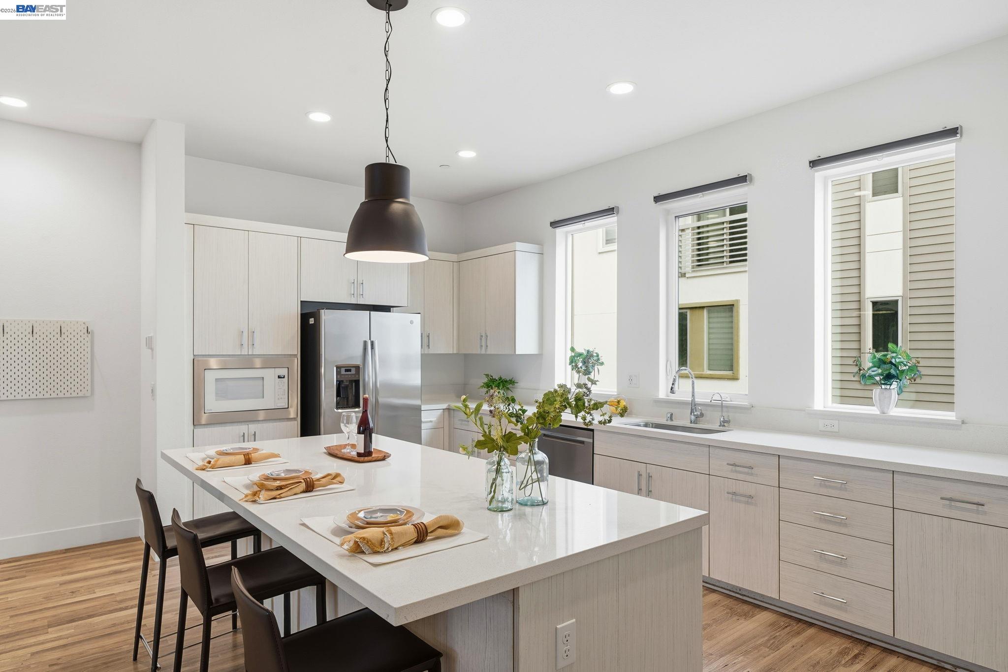 7906 Regional Common Dublin, CA 94568 - Photo 14 of 40 a kitchen with a dining table cabinets and window