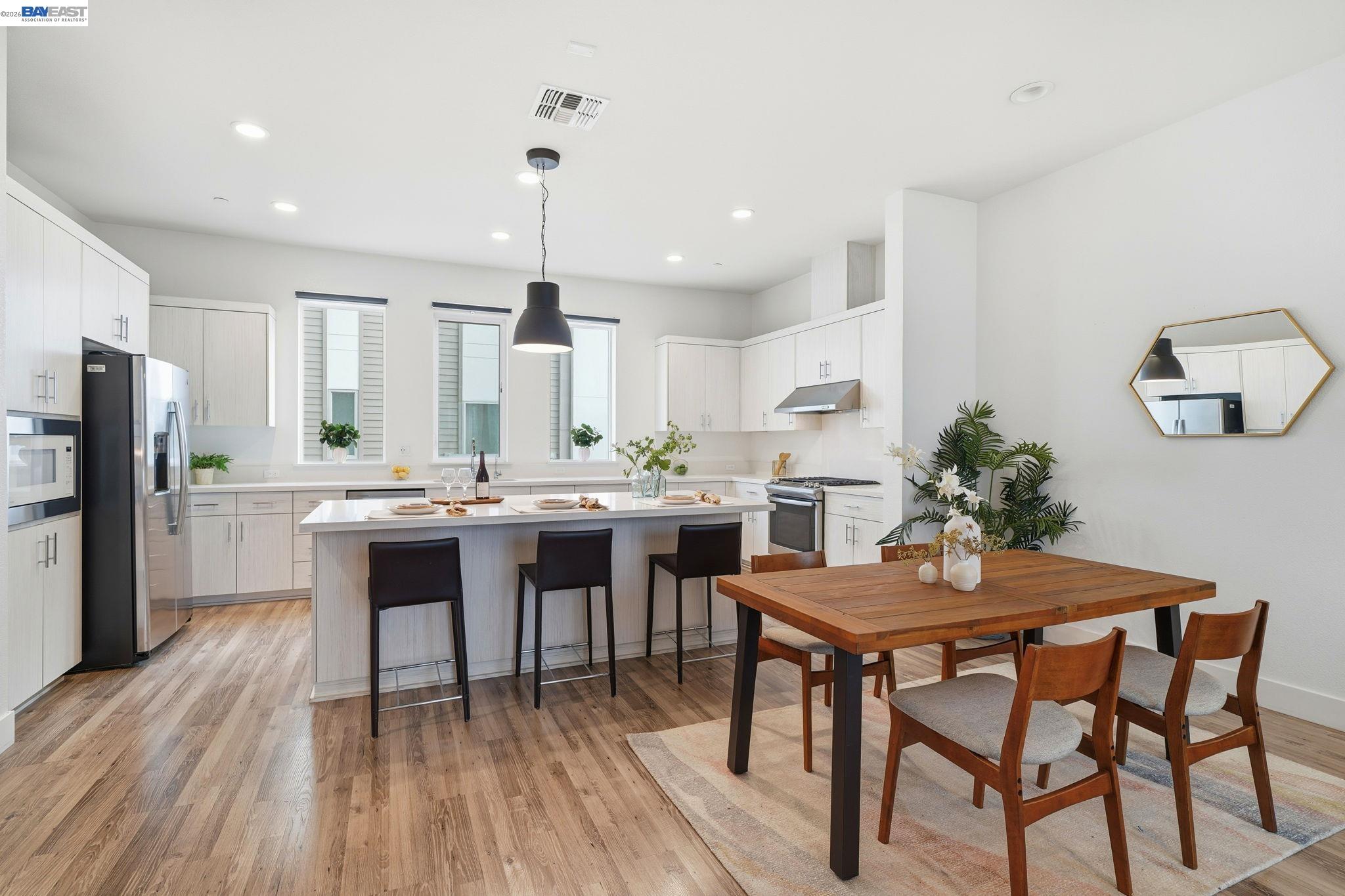 7906 Regional Common Dublin, CA 94568 - Photo 16 of 40 a view of a dining room with furniture and wooden floor