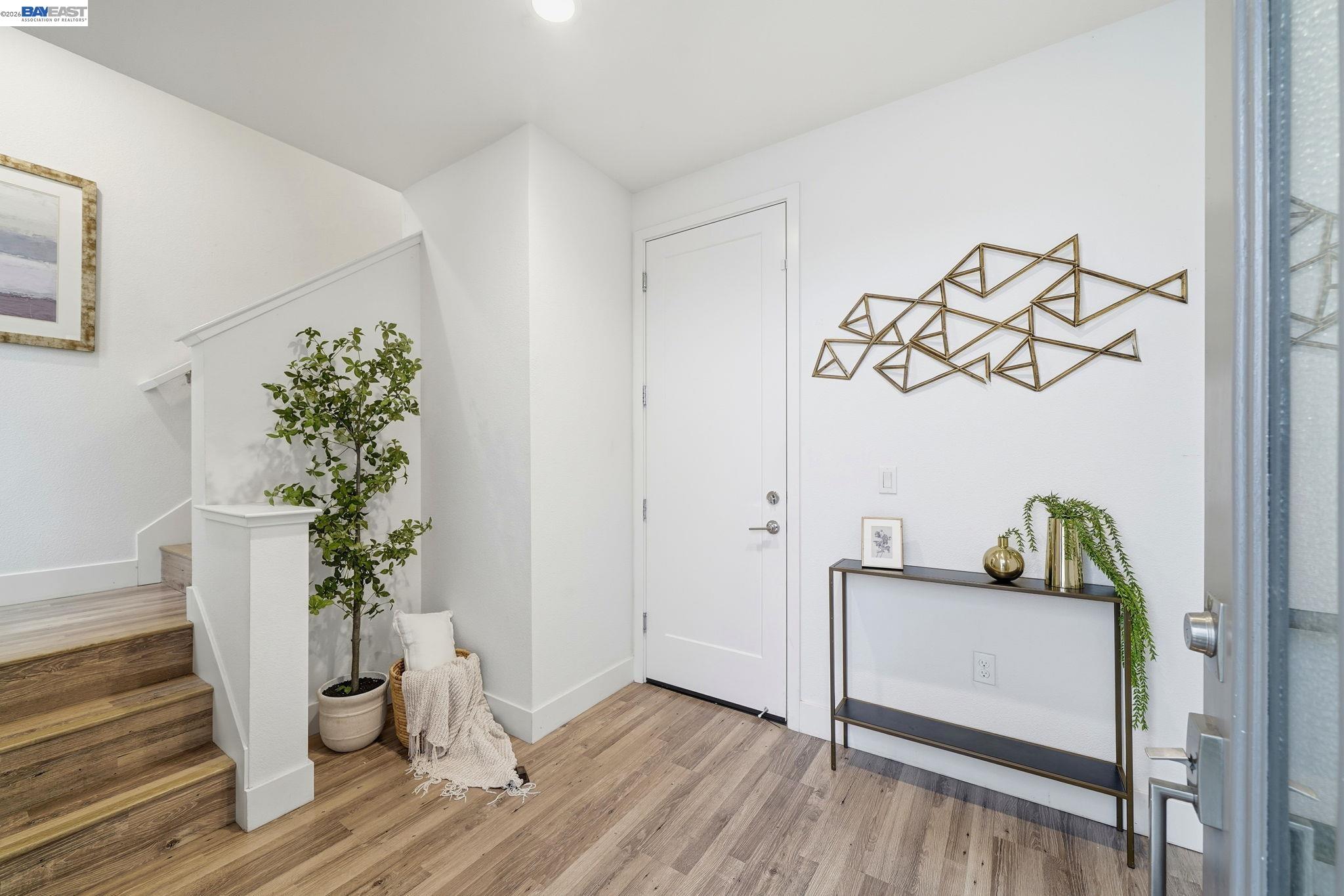7906 Regional Common Dublin, CA 94568 - Photo 2 of 40 a living room with furniture and wooden floor