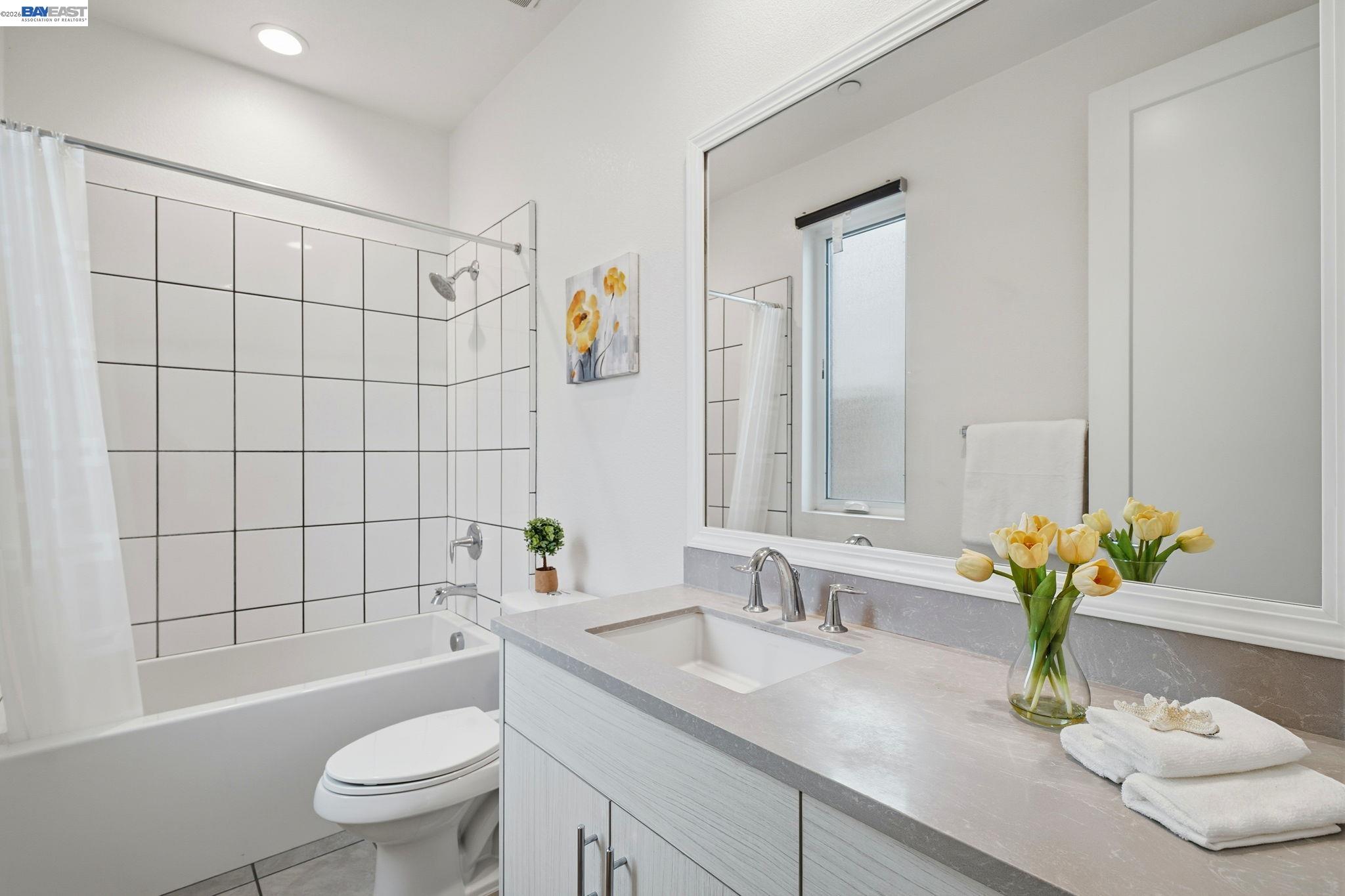 7906 Regional Common Dublin, CA 94568 - Photo 26 of 40 a bathroom with a sink a toilet and shower