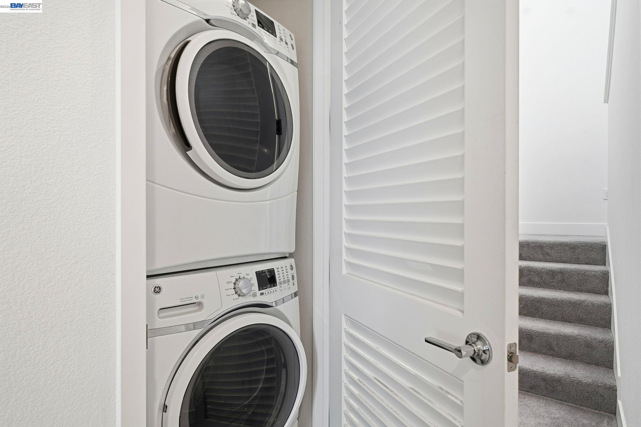 7906 Regional Common Dublin, CA 94568 - Photo 29 of 40 a view of a hallway with washer and dryer