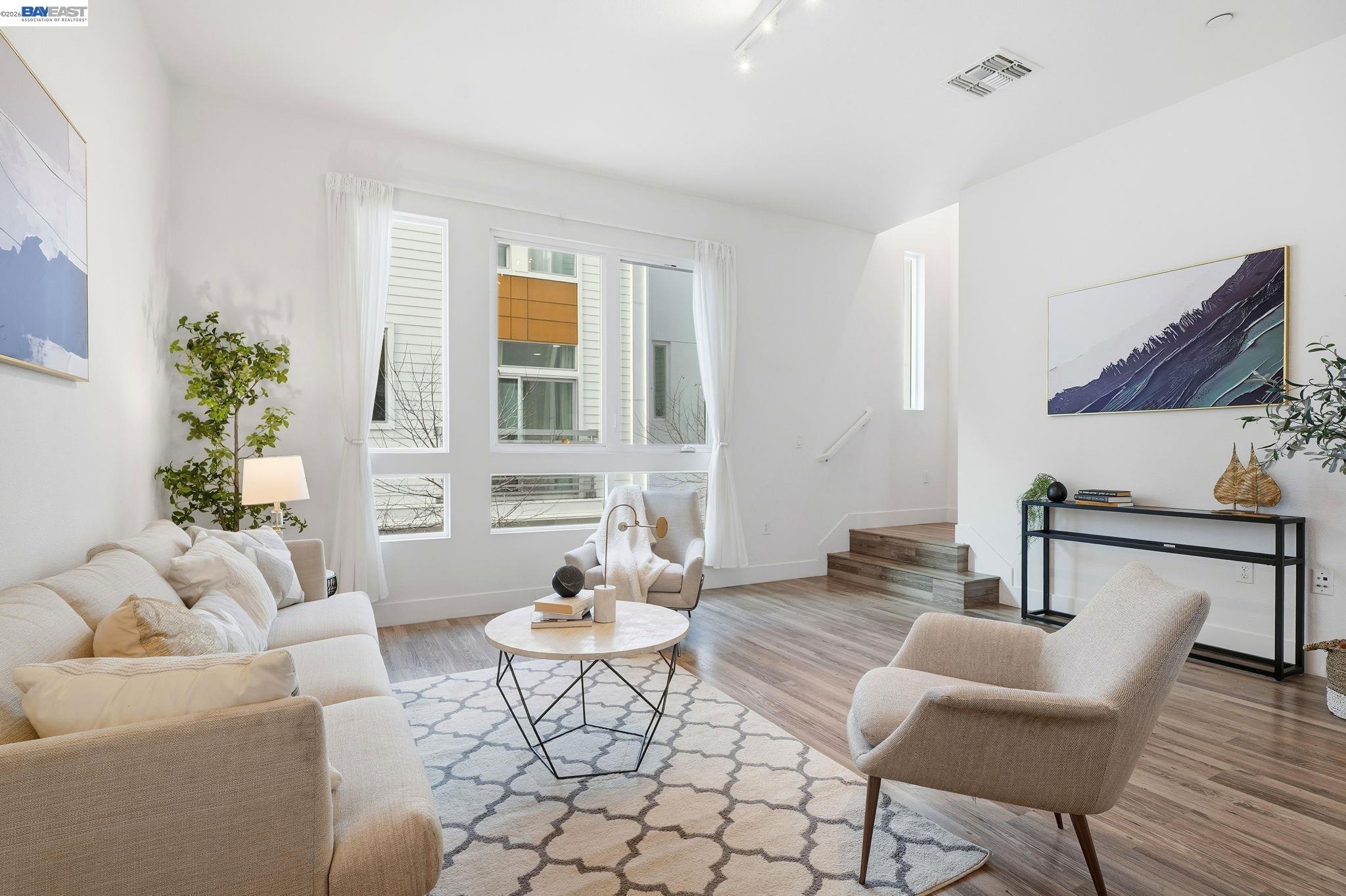 7906 Regional Common Dublin, CA 94568 - Photo 5 of 40 a living room with furniture and wooden floor