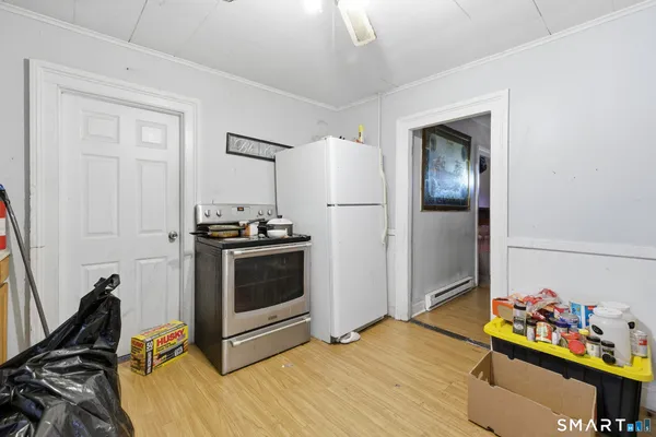 a kitchen with granite countertop a stove and a refrigerator