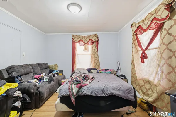 a bed room with a bed and a couch