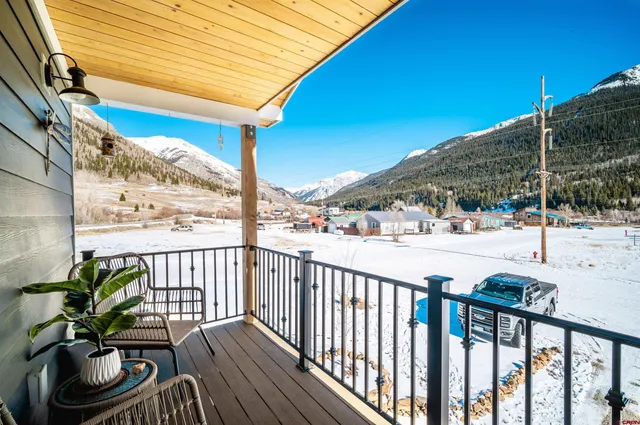 a view of balcony with furniture