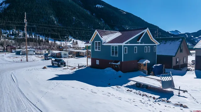 a view of a house with outdoor seating