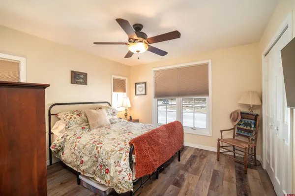a bed room with a bed and a window