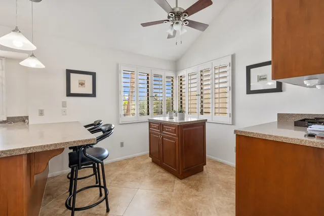 a room with furniture a window and a chandelier