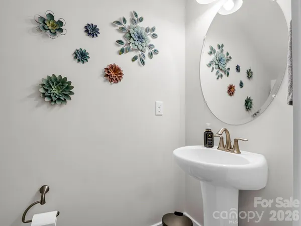 a bathroom with a sink and mirror