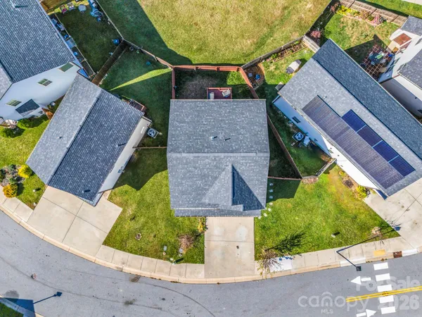 an aerial view of a house with a swimming pool