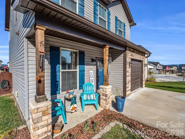 a front view of a house with outdoor seating