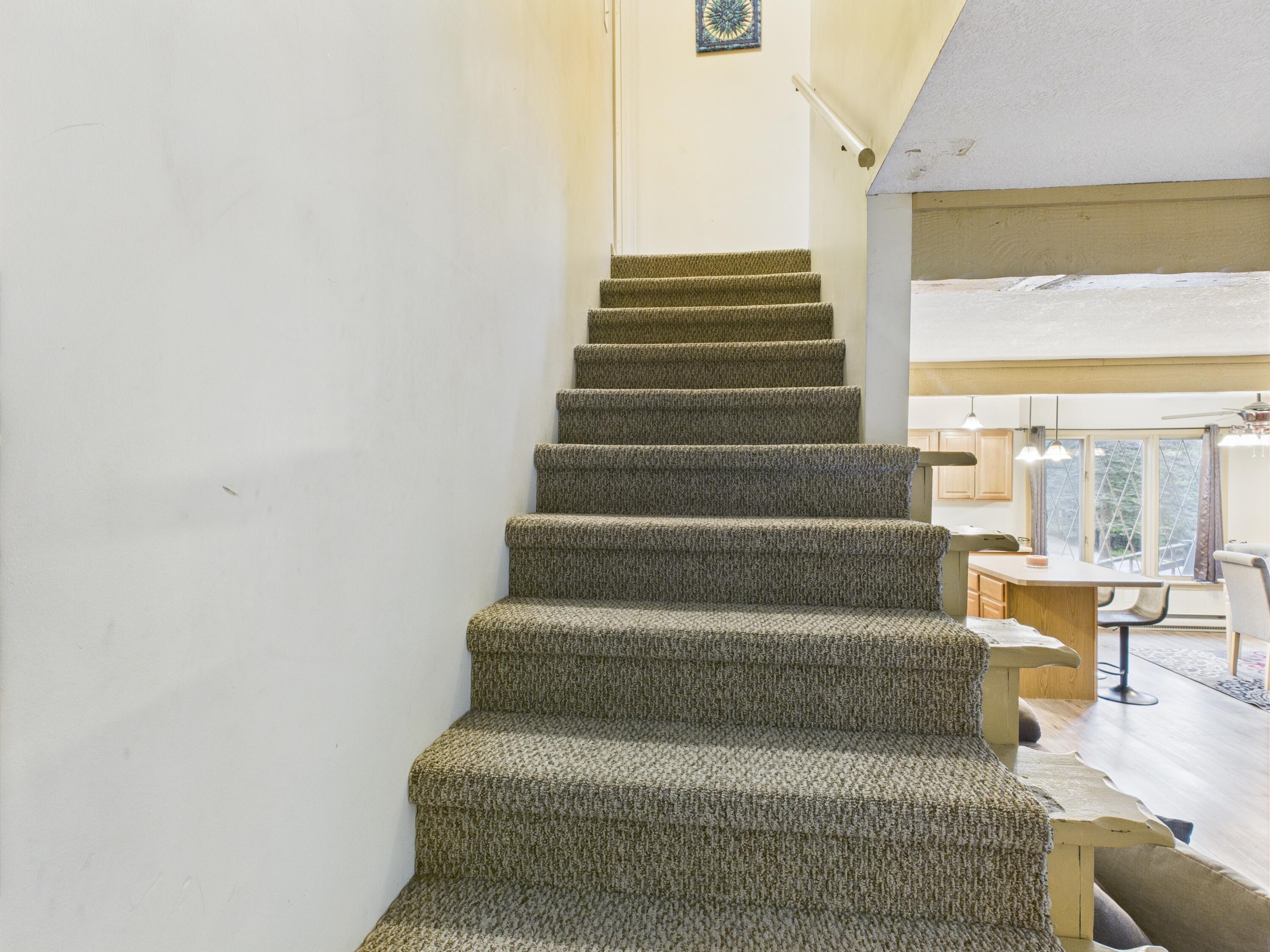 5589 Algonquin Road Gaylord, MI 49735 - Photo 9 of 16 going up the stairs