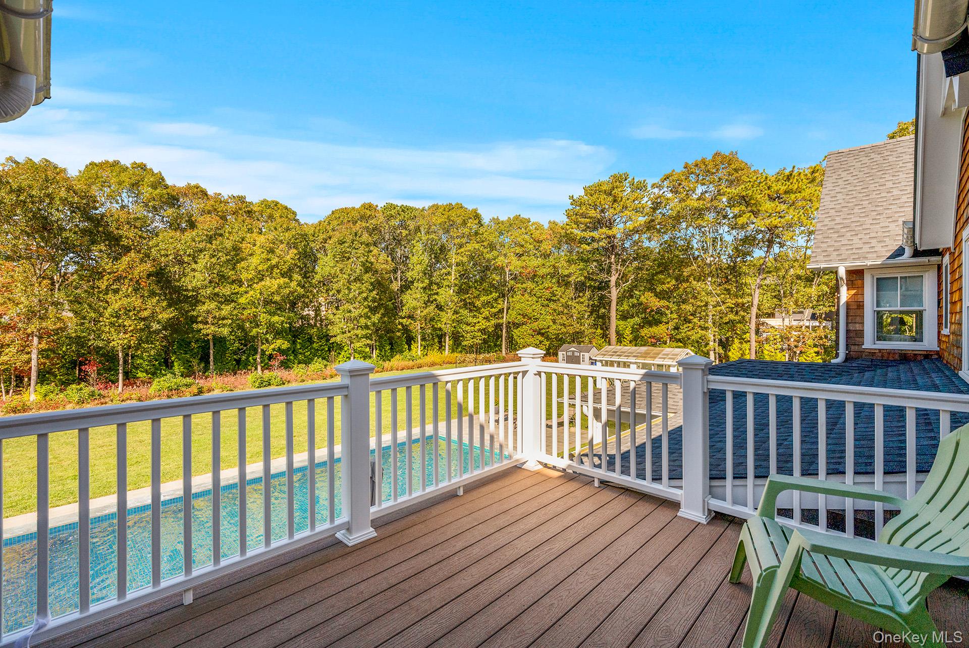 41 Arbutus Road Quogue, NY 11959 - Photo 21 of 35 a view of a balcony with wooden floor and fence