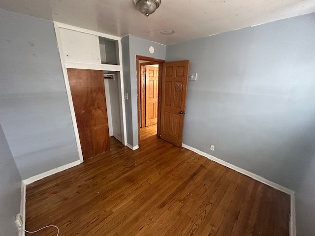 519 North Forest Avenue Mount Prospect, IL 60056 - Photo 13 of 20 an empty room with wooden floor and windows