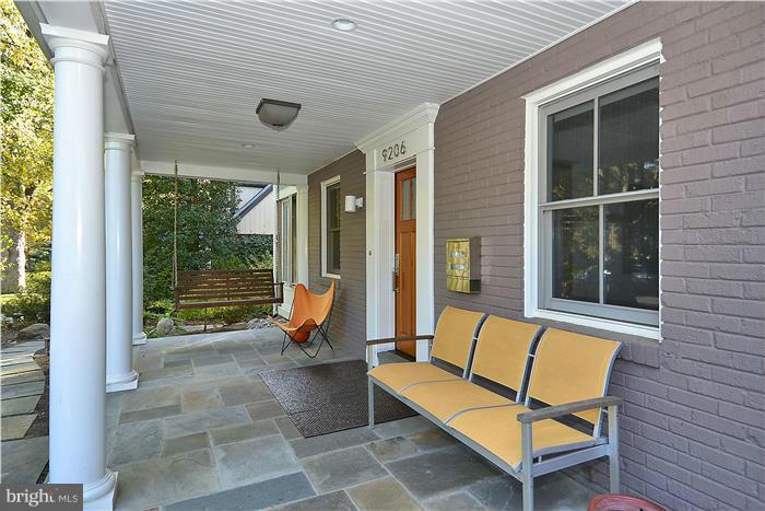 9206 Saybrook Avenue Silver Spring, MD 20901 - Photo 2 of 30 a building outdoor space with patio furniture and garden