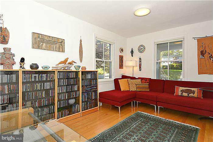 9206 Saybrook Avenue Silver Spring, MD 20901 - Photo 11 of 30 a living room with furniture a rug and a window