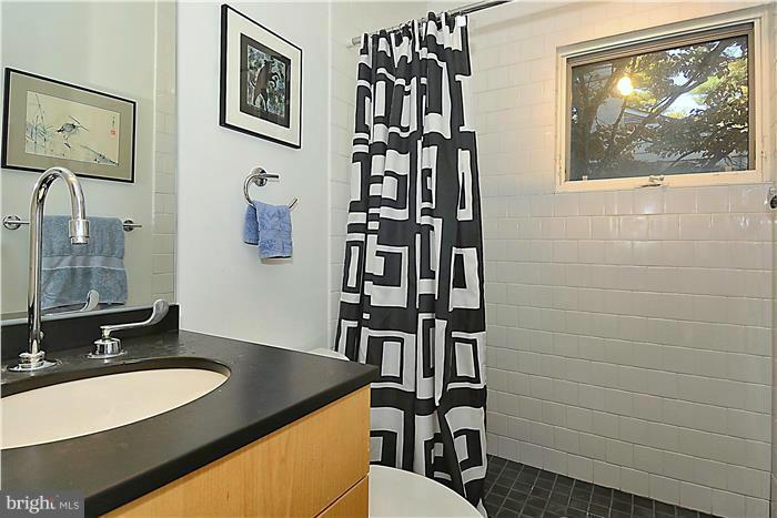 9206 Saybrook Avenue Silver Spring, MD 20901 - Photo 14 of 30 a bathroom with a sink and a mirror