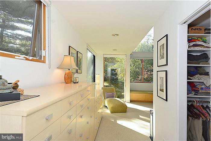 9206 Saybrook Avenue Silver Spring, MD 20901 - Photo 20 of 30 a spacious bedroom with a large window and a bed