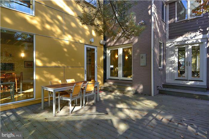 9206 Saybrook Avenue Silver Spring, MD 20901 - Photo 28 of 30 a view of a patio with table and chairs
