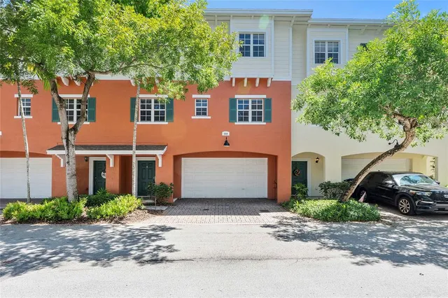 a view of a car parked front of a house
